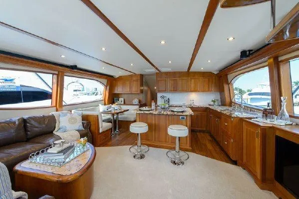 Sixpack Yacht Photos Pics Luxurious interior of 2013 Hatteras GT63 yacht with elegant wood finishes and modern amenities.