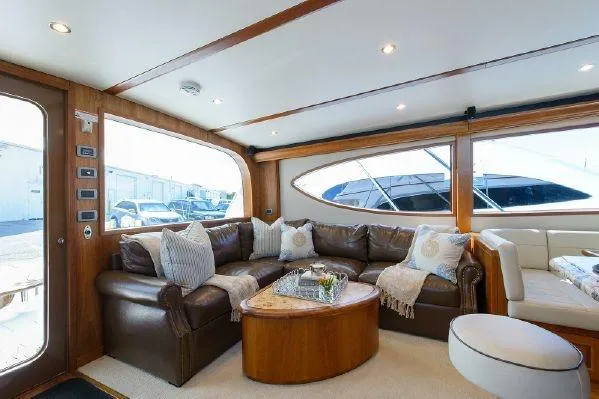 Sixpack Yacht Photos Pics Luxurious interior of 2013 Hatteras GT63 yacht with leather seating and elegant decor.