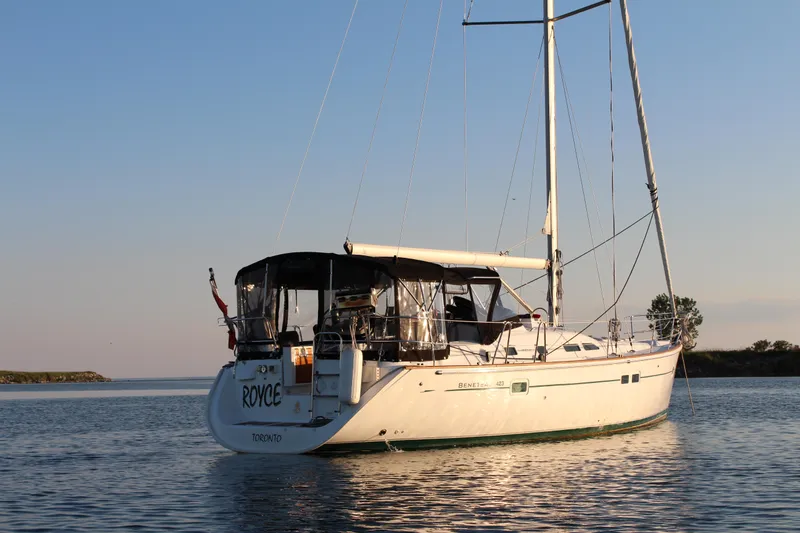 Royce Yacht Photos Pics Sailing yacht Beneteau 423, 2007 model, anchored on calm water at sunset.