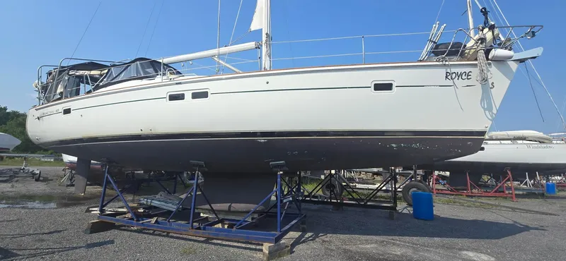 Royce Yacht Photos Pics 2007 Beneteau 423 sailboat on stands, ready for maintenance, under clear blue sky.