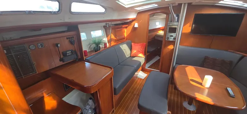 Royce Yacht Photos Pics Interior of a 2007 Beneteau 423 sailboat with modern furnishings and wood accents.