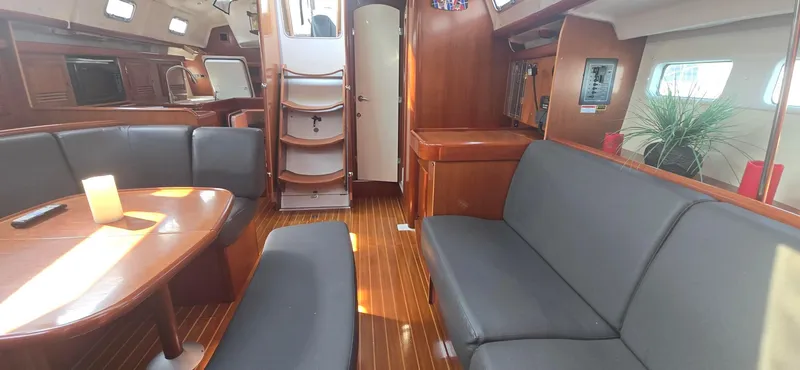 Royce Yacht Photos Pics Interior of 2007 Beneteau 423 yacht with elegant wood finish and modern seating.