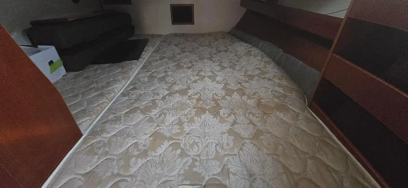 Royce Yacht Photos Pics Interior cabin of a 2007 Beneteau 423 sailboat with patterned bedding.