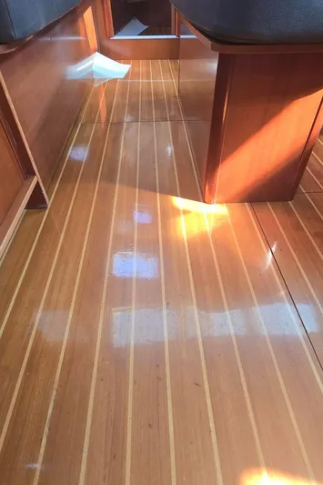 Royce Yacht Photos Pics Interior view of 2007 Beneteau 423 sailboat with polished wooden flooring.