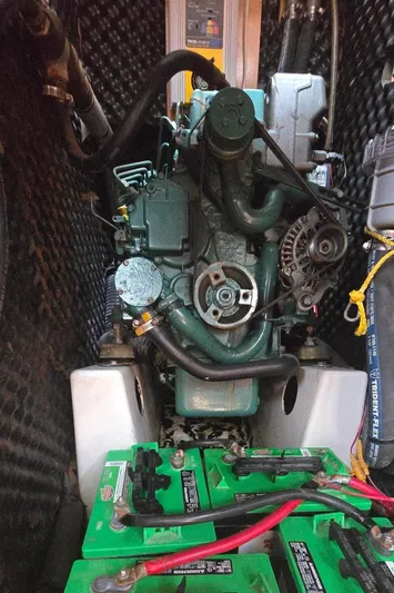 Royce Yacht Photos Pics Engine compartment of a 2007 Beneteau 423 sailboat with visible batteries and wiring.