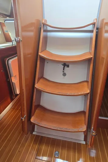 Royce Yacht Photos Pics Wooden interior stairs on a 2007 Beneteau 423 sailboat.