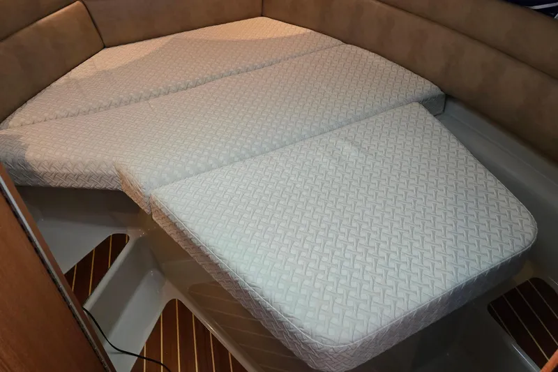 Triton Yacht Photos Pics 2011 Ranger Tugs R-29 interior cabin with cushioned sleeping area.