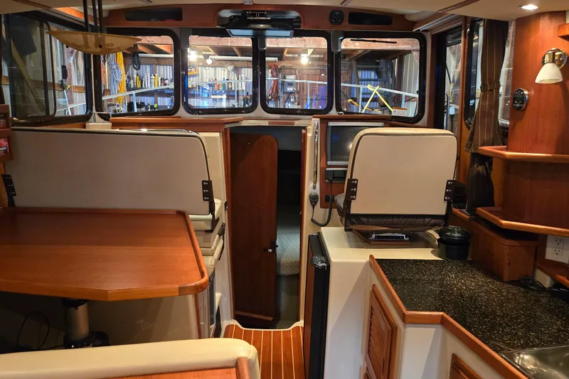Triton Yacht Photos Pics Interior of 2011 Ranger Tugs R-29 boat with wood finishes and navigation area.