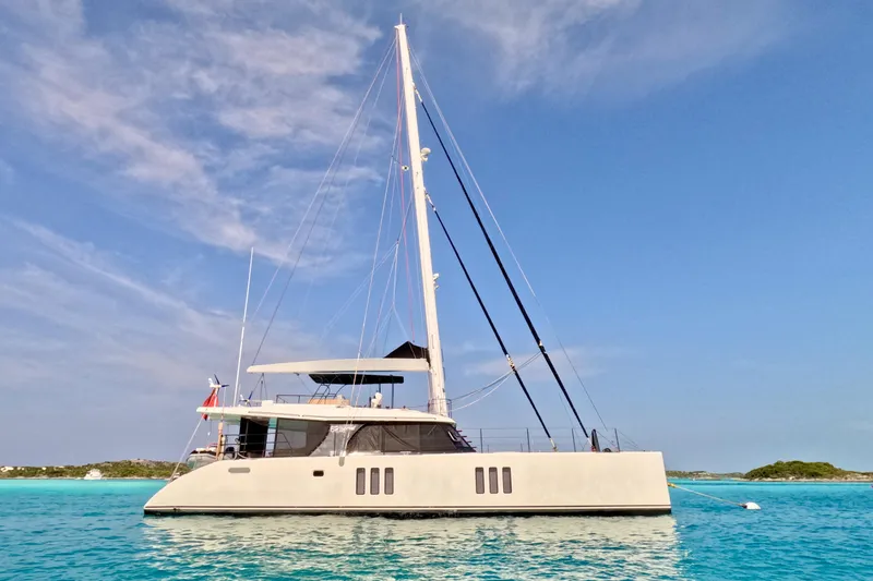 Deo Juvante Yacht Photos Pics Luxurious 2018 Sunreef 62 ARC catamaran sailing on clear blue waters.
