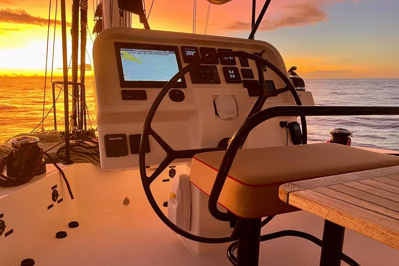 Deo Juvante Yacht Photos Pics Sunset view from Sunreef 62 ARC yacht cockpit, 2018 model, with navigation equipment.