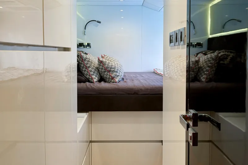 Deo Juvante Yacht Photos Pics Luxurious cabin interior of 2018 Sunreef 62 ARC yacht with modern design and cozy bedding.