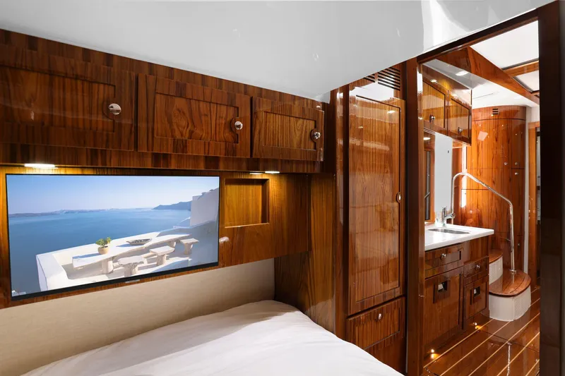 Big Momma Yacht Photos Pics Luxurious interior of 2023 HCB 65 Estrella yacht with wood finish and modern amenities.