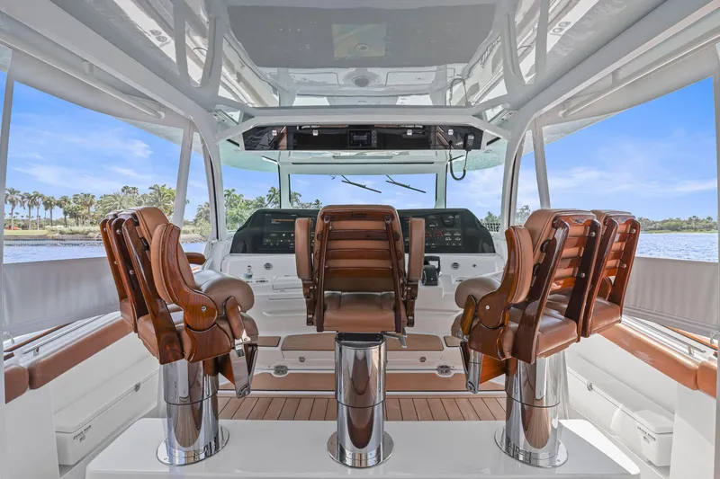 Big Momma Yacht Photos Pics 2023 HCB 65 Estrella yacht interior with luxurious leather seating and advanced navigation controls.
