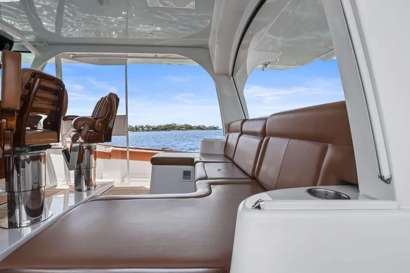 Big Momma Yacht Photos Pics Luxurious interior of 2023 HCB 65 Estrella yacht with leather seating and ocean view.