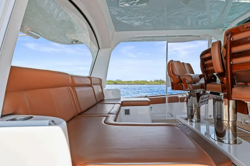 Big Momma Yacht Photos Pics Luxurious interior of 2023 HCB 65 Estrella yacht with leather seating and ocean view.