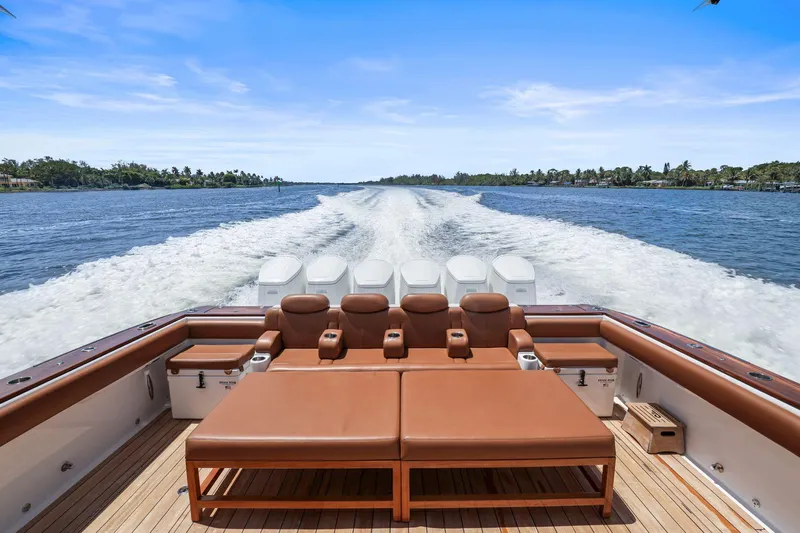 Big Momma Yacht Photos Pics 2023 HCB 65 Estrella luxury boat cruising on a scenic waterway.