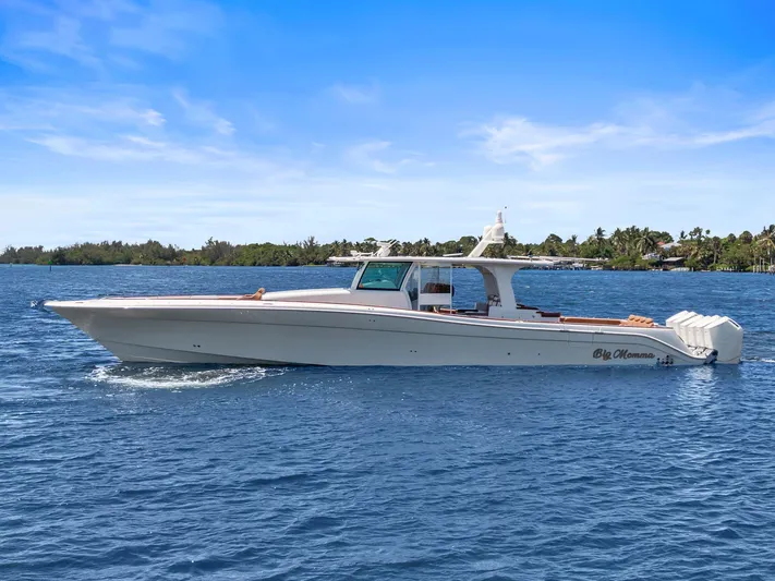Big Momma Yacht Photos Pics 2023 HCB 65 Estrella luxury boat cruising on blue water under clear sky.