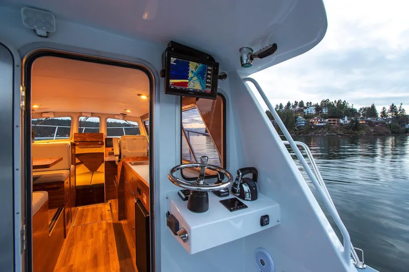 Hardy Yacht Photos Pics Manufacturer Provided Image: 2020 Coastal Craft 33 ProFish boat interior and helm station on calm water.
