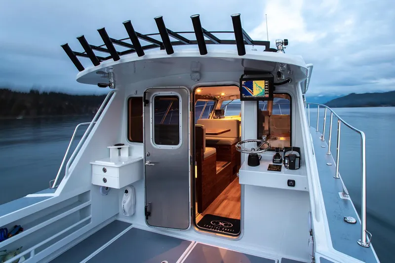 Hardy Yacht Photos Pics Manufacturer Provided Image: 2020 Coastal Craft 33 ProFish boat interior with fishing rod holders and modern amenities.