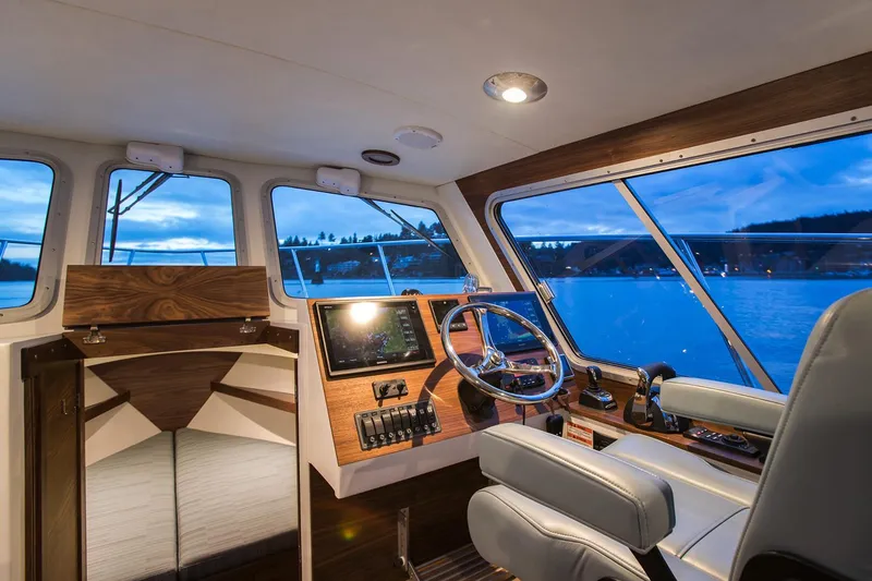Hardy Yacht Photos Pics Manufacturer Provided Image: Interior of 2020 Coastal Craft 33 ProFish boat with modern helm and panoramic windows.