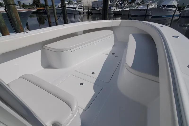 Dragonfly Yacht Photos Pics 2014 Bahama 41 FS boat interior with seating and storage, docked at marina.