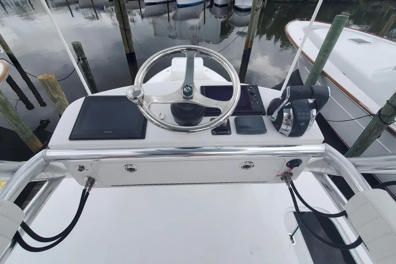 Dragonfly Yacht Photos Pics 2014 Bahama 41 FS boat helm with steering wheel and controls at dock.