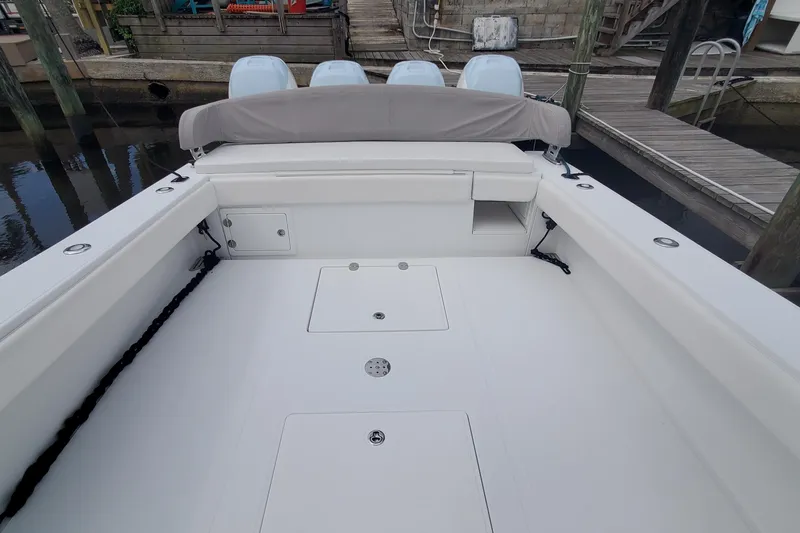 Dragonfly Yacht Photos Pics 2014 Bahama 41 FS boat deck with four engines at dock.