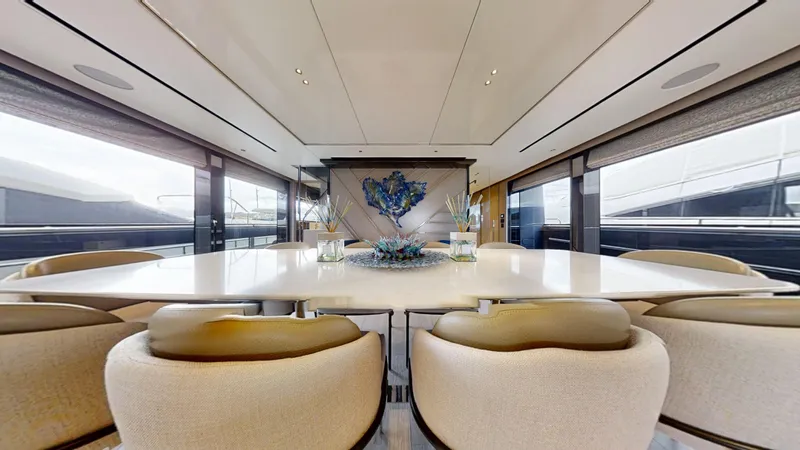 Majic Yacht Photos Pics Luxurious interior of 2023 Sunseeker 100 Yacht with elegant dining area and modern decor.