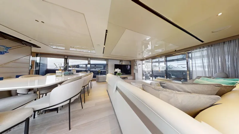 Majic Yacht Photos Pics Luxurious interior of 2023 Sunseeker 100 Yacht with elegant seating and dining area.