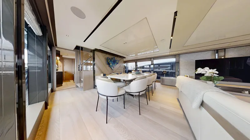 Majic Yacht Photos Pics Luxurious interior of 2023 Sunseeker 100 Yacht with elegant dining area and modern decor.