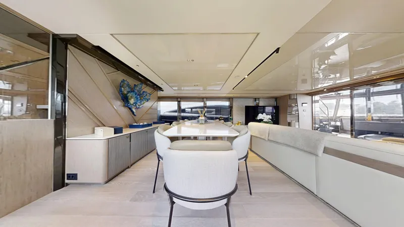 Majic Yacht Photos Pics Luxurious interior of 2023 Sunseeker 100 Yacht with elegant dining area and modern decor.