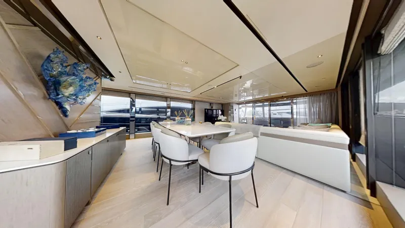Majic Yacht Photos Pics Luxurious interior of 2023 Sunseeker 100 Yacht with elegant dining and seating area.