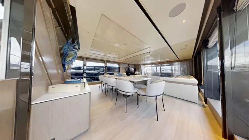 Majic Yacht Photos Pics Luxurious interior of 2023 Sunseeker 100 Yacht with elegant dining area and modern design.