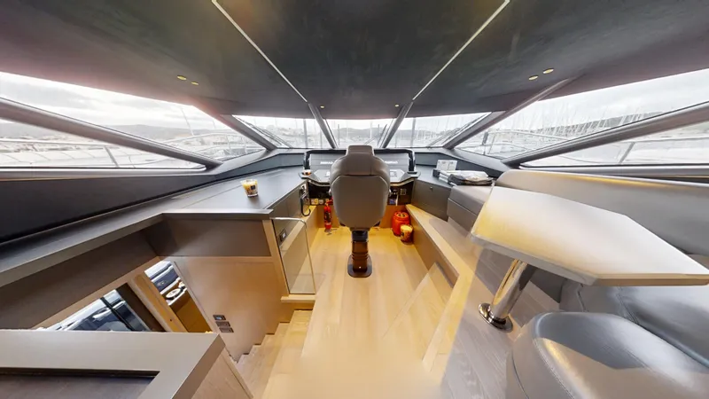 Majic Yacht Photos Pics Luxurious interior of 2023 Sunseeker 100 Yacht cockpit with modern design and panoramic windows.