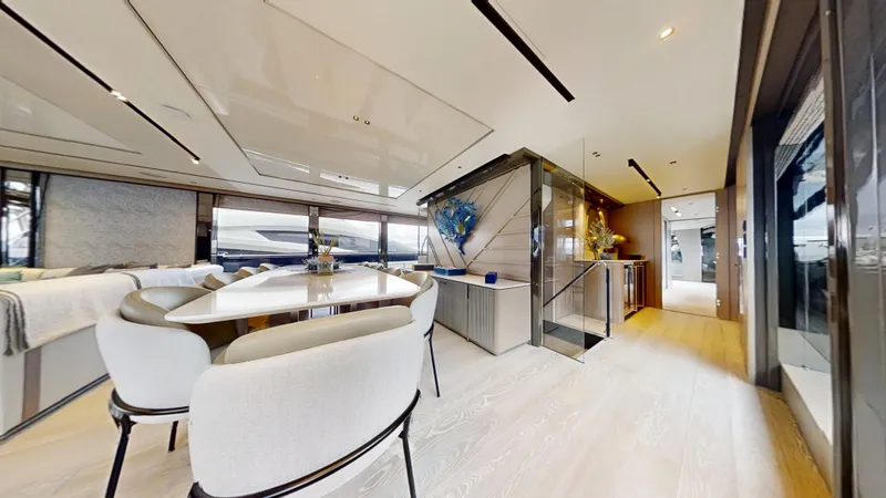 Majic Yacht Photos Pics Luxurious interior of 2023 Sunseeker 100 Yacht with elegant dining area and modern decor.
