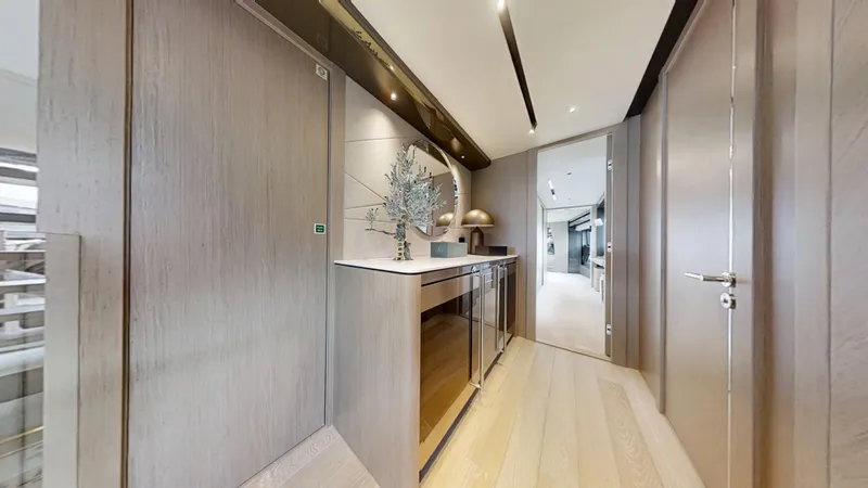 Majic Yacht Photos Pics Luxurious interior hallway of 2023 Sunseeker 100 Yacht with modern decor and lighting.