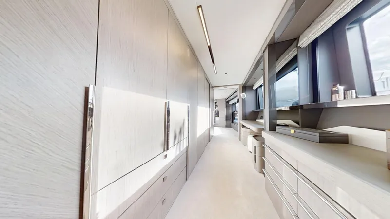 Majic Yacht Photos Pics Luxurious interior hallway of 2023 Sunseeker 100 Yacht with modern design and ample storage.