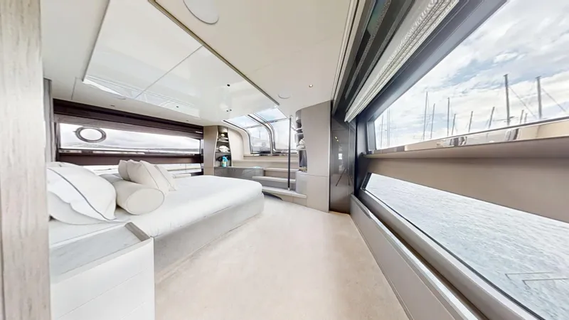 Majic Yacht Photos Pics Luxurious interior of 2023 Sunseeker 100 Yacht with panoramic windows and elegant furnishings.