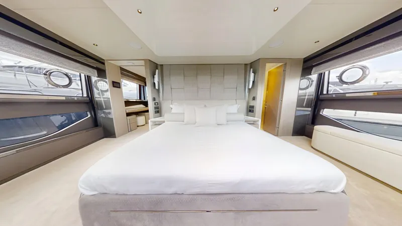 Majic Yacht Photos Pics Luxurious bedroom interior of 2023 Sunseeker 100 Yacht with modern design and large windows.