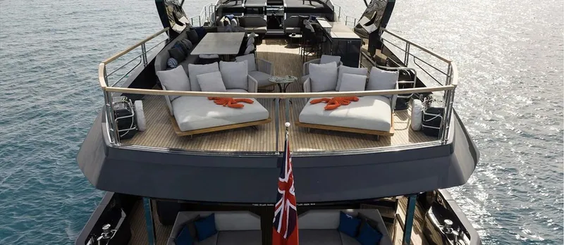 Majic Yacht Photos Pics Luxurious 2023 Sunseeker 100 Yacht with spacious deck and elegant seating on the water.