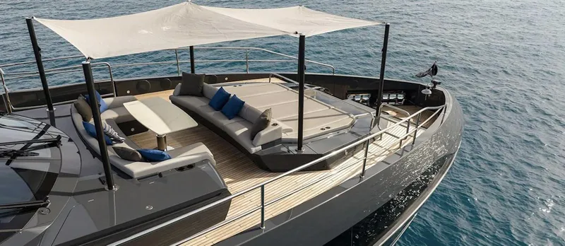 Majic Yacht Photos Pics Luxurious 2023 Sunseeker 100 Yacht with elegant deck and seating area on the ocean.