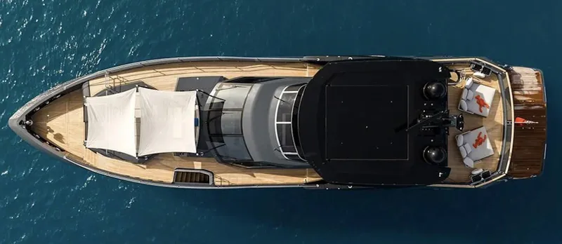 Majic Yacht Photos Pics Aerial view of 2023 Sunseeker 100 Yacht on blue ocean water.