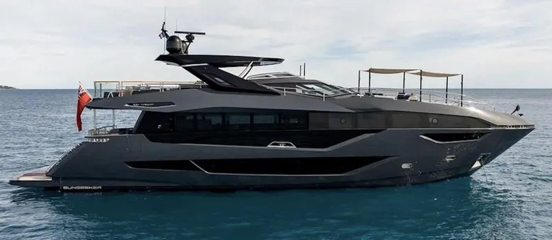 Majic Yacht Photos Pics 2023 Sunseeker 100 Yacht on calm blue waters, showcasing sleek design and luxury features.