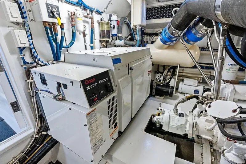 Satellite Office Yacht Photos Pics Engine room of 2008 Hatteras 64 Motor Yacht with Onan marine generator.