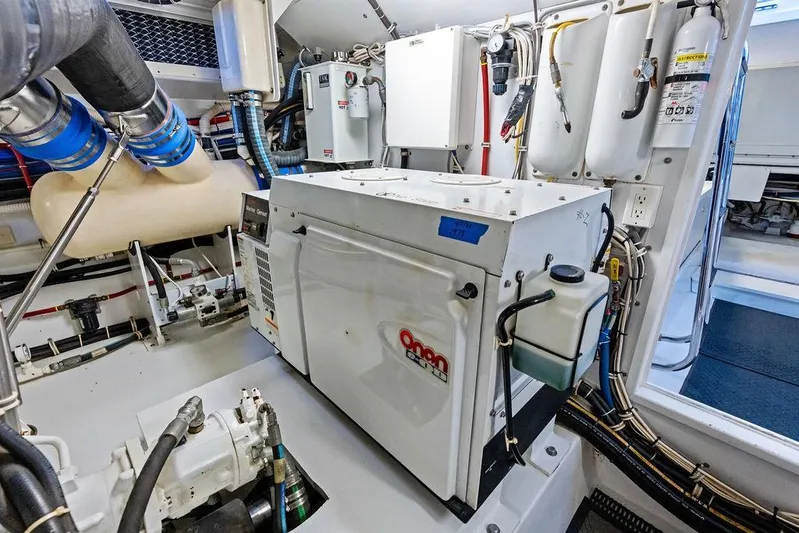 Satellite Office Yacht Photos Pics Engine room of 2008 Hatteras 64 Motor Yacht with Onan generator and mechanical systems.