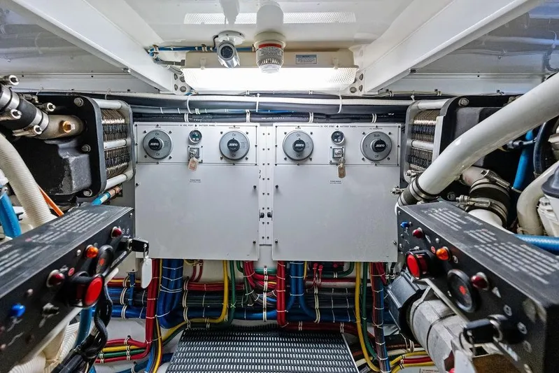Satellite Office Yacht Photos Pics Engine room of 2008 Hatteras 64 Motor Yacht with control panels and wiring.