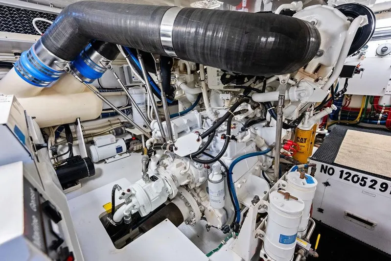 Satellite Office Yacht Photos Pics Engine room of 2008 Hatteras 64 Motor Yacht, showcasing complex machinery and components.