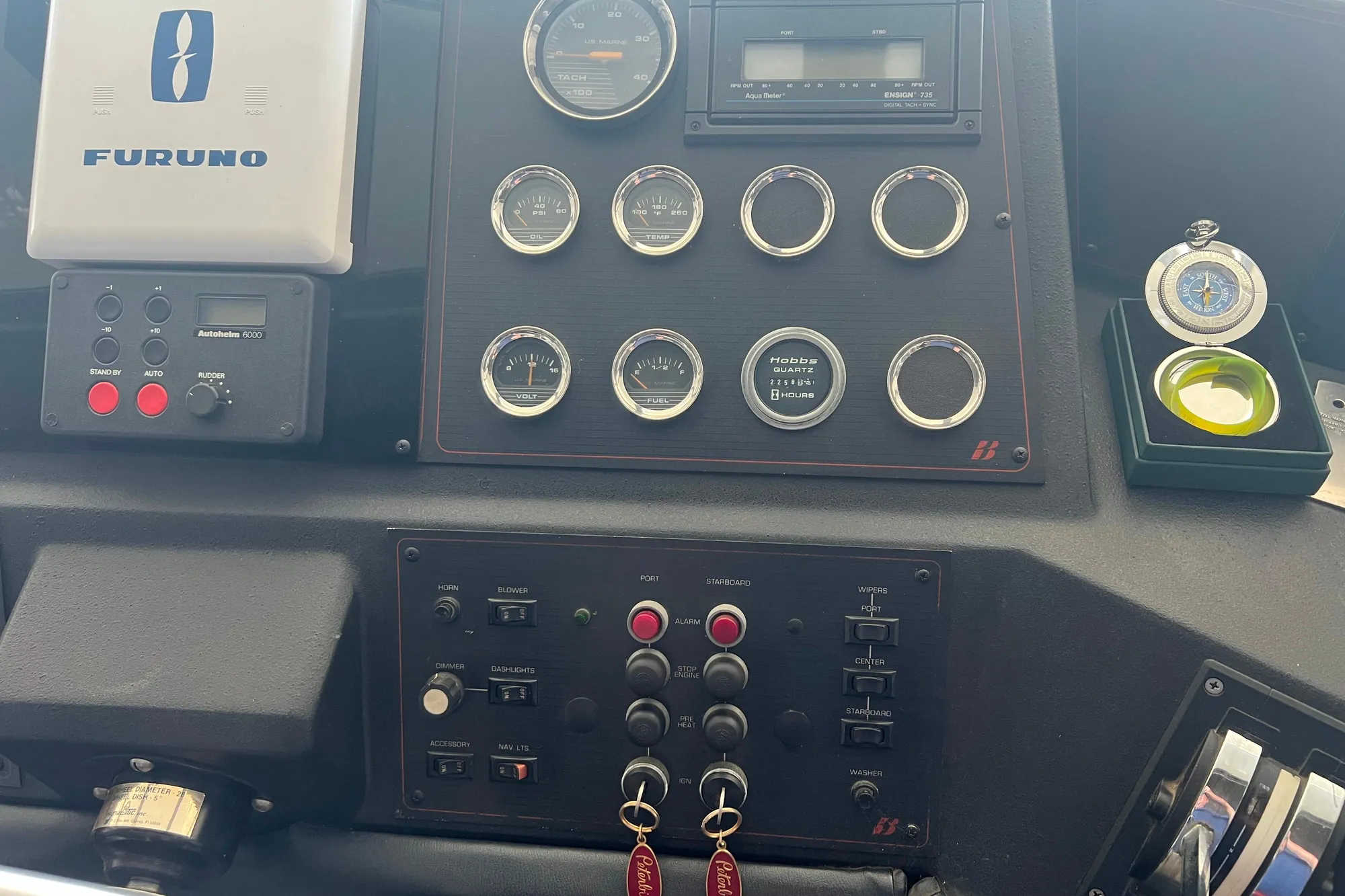 Control panel of 1986 Bayliner 4550 Motoryacht with gauges and navigation equipment.