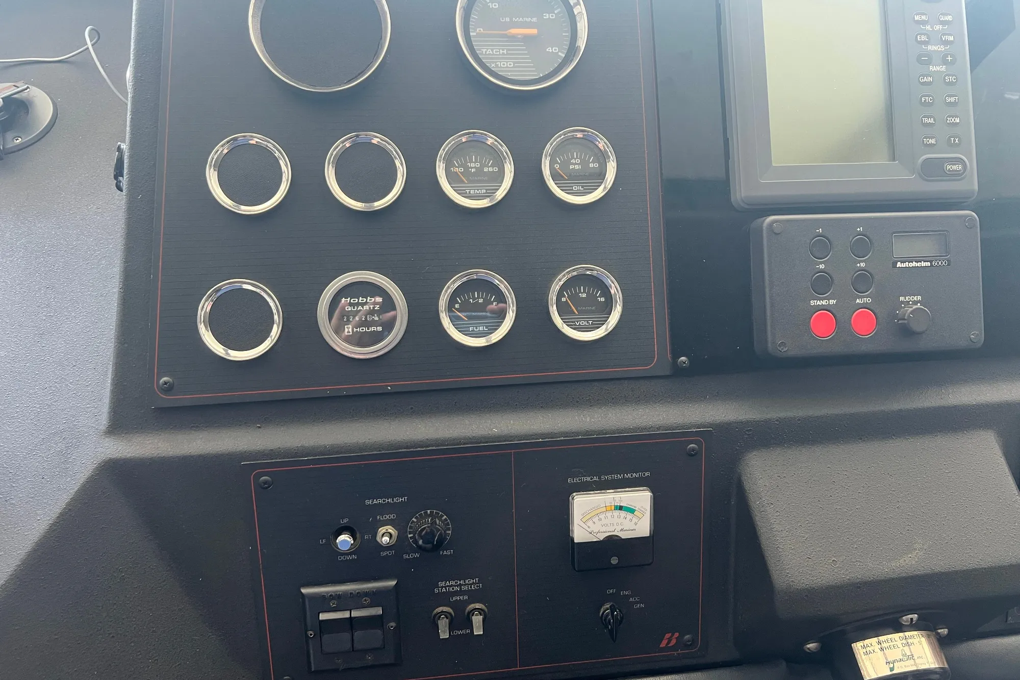 Control panel of a 1986 Bayliner 4550 Motoryacht with gauges and navigation equipment.