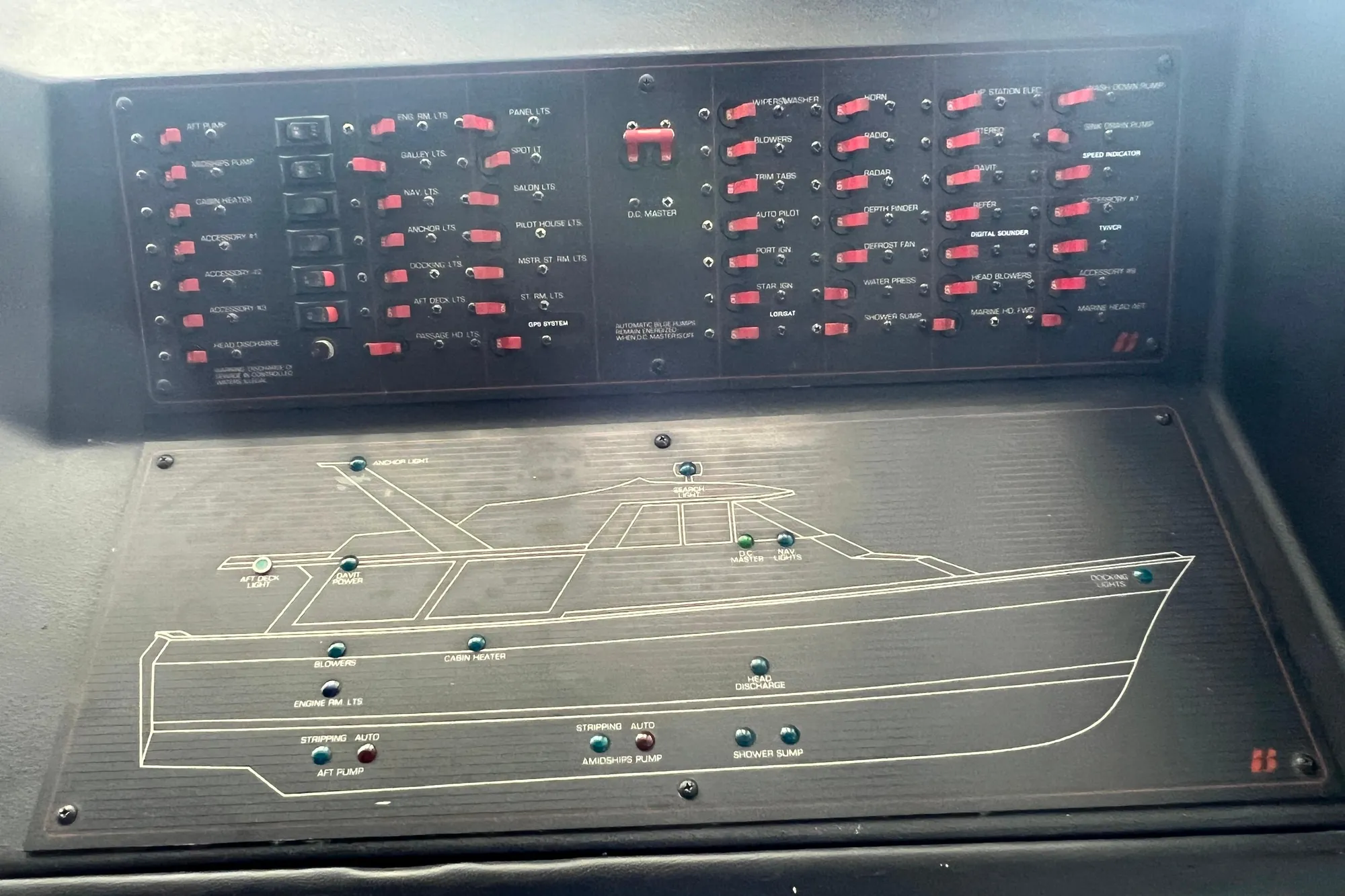 Control panel of a 1986 Bayliner 4550 Motoryacht with labeled switches and diagram.
